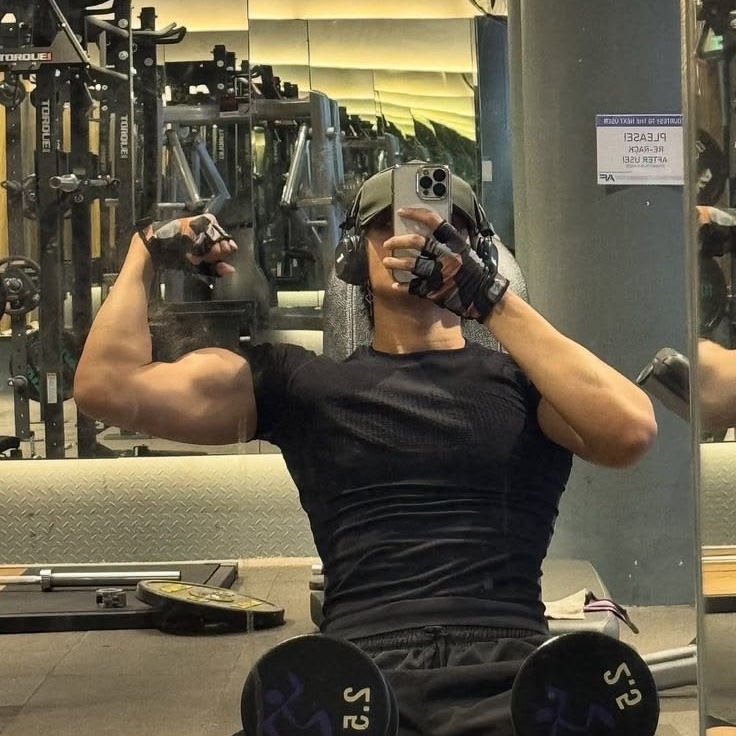 just stretching out the old biceps, nothing to see here. unless you're looking.